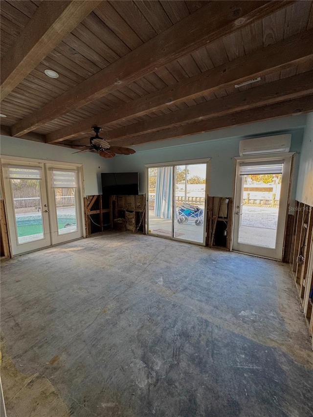 unfurnished living room featuring ceiling fan, plenty of natural light, beamed ceiling, and a wall mounted AC