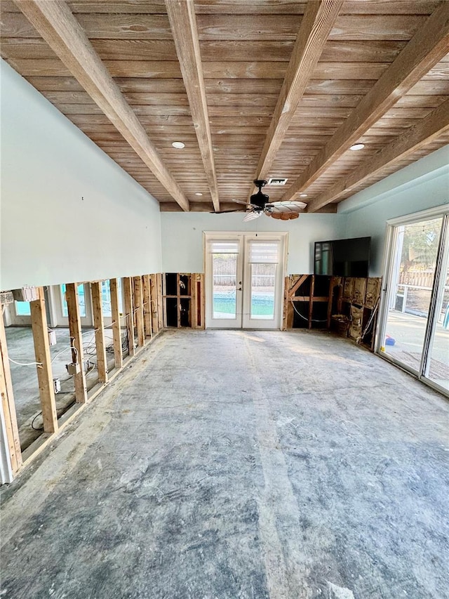 interior space featuring ceiling fan, a healthy amount of sunlight, wooden ceiling, and beamed ceiling