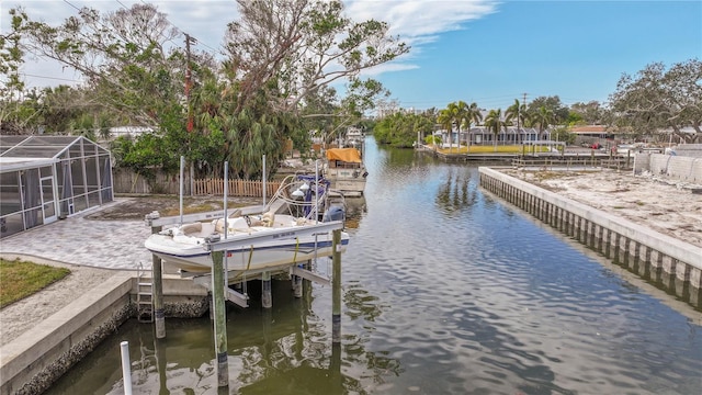 dock area featuring a water view and glass enclosure