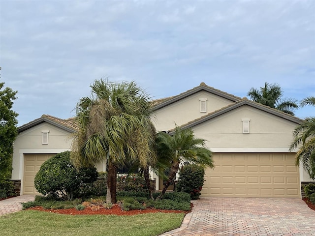 single story home with a front lawn and a garage