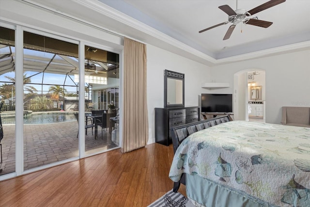 bedroom featuring hardwood / wood-style floors, ceiling fan, access to exterior, and crown molding