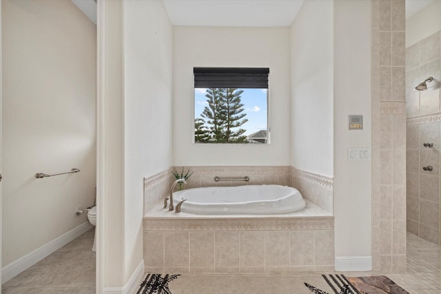 bathroom featuring tile patterned flooring, shower with separate bathtub, and toilet