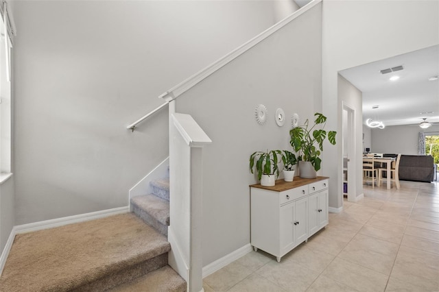 stairway with tile patterned flooring