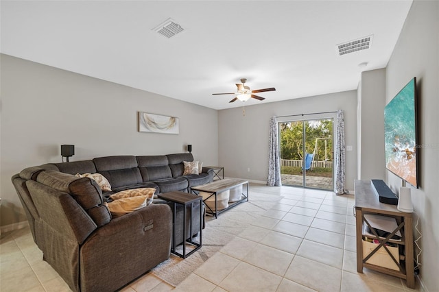 tiled living room with ceiling fan