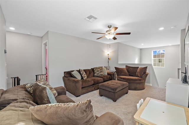 living room featuring ceiling fan and light carpet