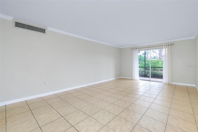 tiled empty room featuring crown molding