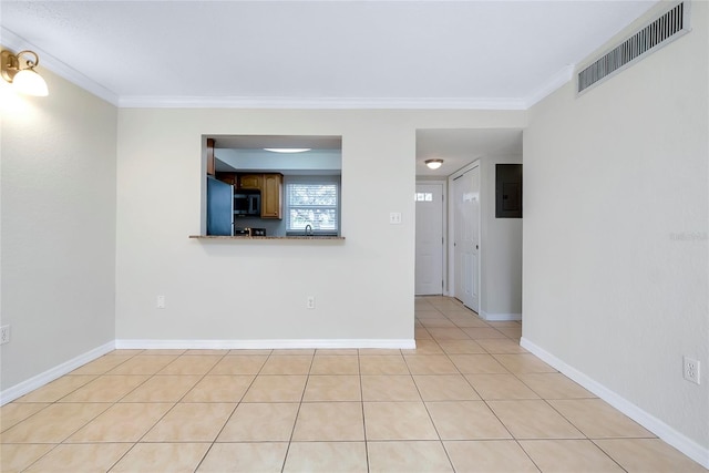 tiled empty room with crown molding