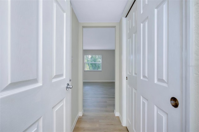 hall with light hardwood / wood-style floors