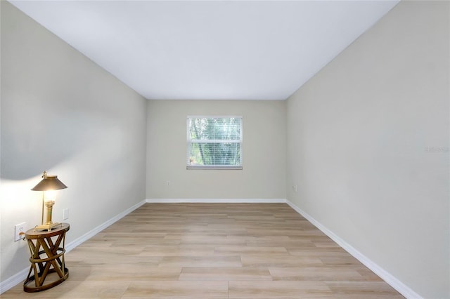 empty room with light hardwood / wood-style floors