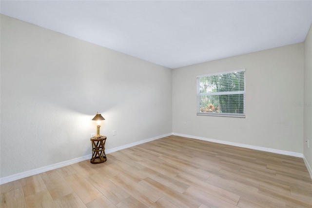 unfurnished room with light hardwood / wood-style floors