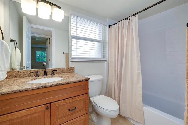 full bathroom featuring toilet, vanity, tile patterned floors, and shower / bath combination with curtain