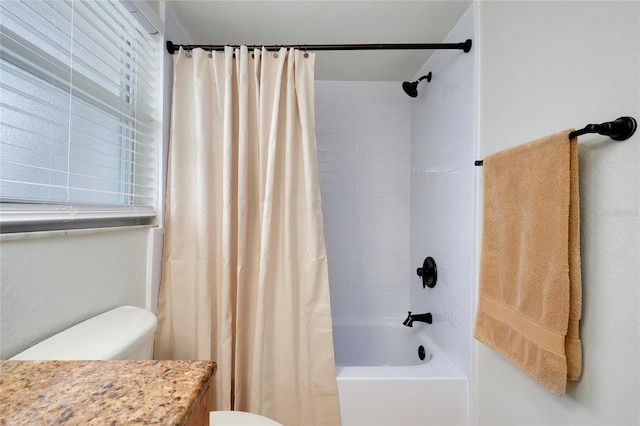 full bathroom with toilet, vanity, and shower / bathtub combination with curtain