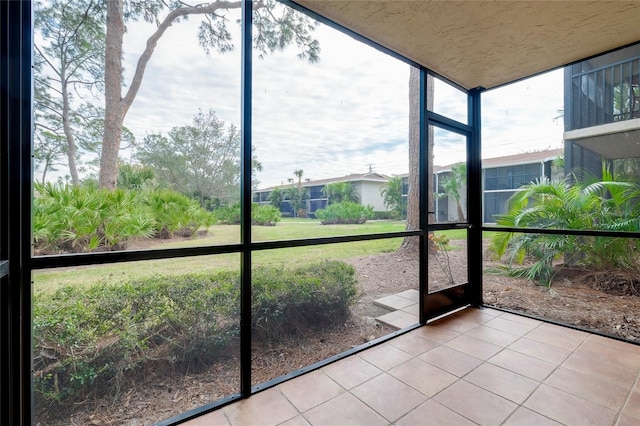 unfurnished sunroom featuring plenty of natural light