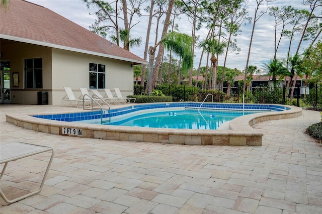 view of swimming pool featuring a patio