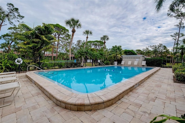 view of swimming pool featuring a patio area