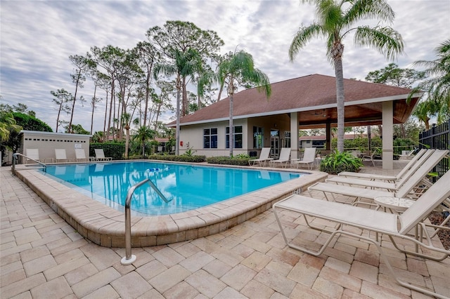 view of pool featuring ceiling fan and a patio