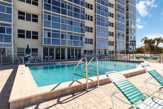 view of pool featuring a patio