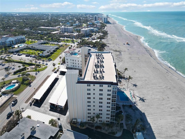 aerial view featuring a water view and a beach view