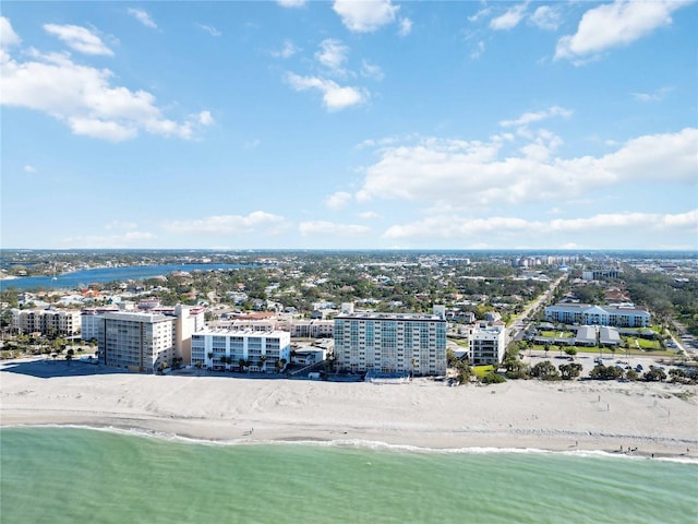 birds eye view of property featuring a view of the beach and a water view