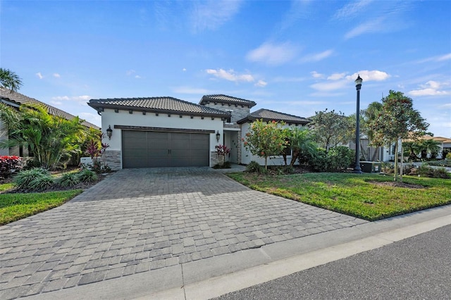 view of front of house with a garage and a front yard