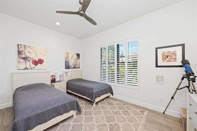 bedroom featuring ceiling fan and light hardwood / wood-style flooring