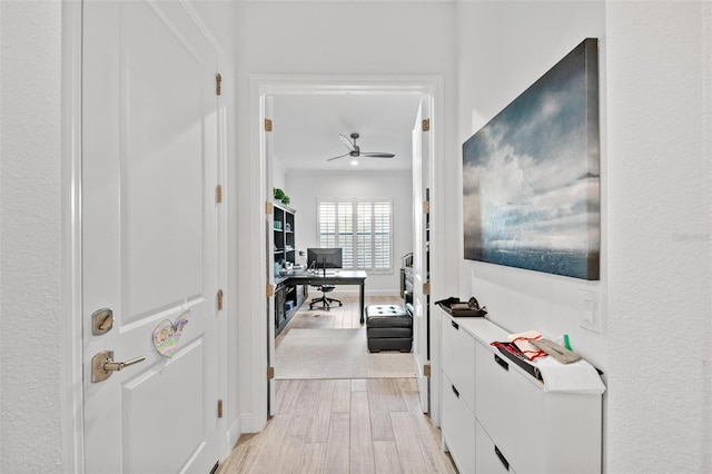 corridor with light wood-type flooring