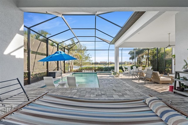 view of pool featuring a lanai and a patio area