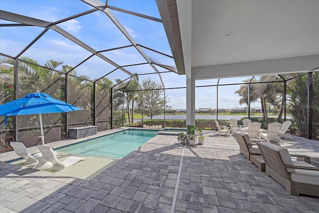 view of pool featuring a lanai, a patio area, and a pool with connected hot tub