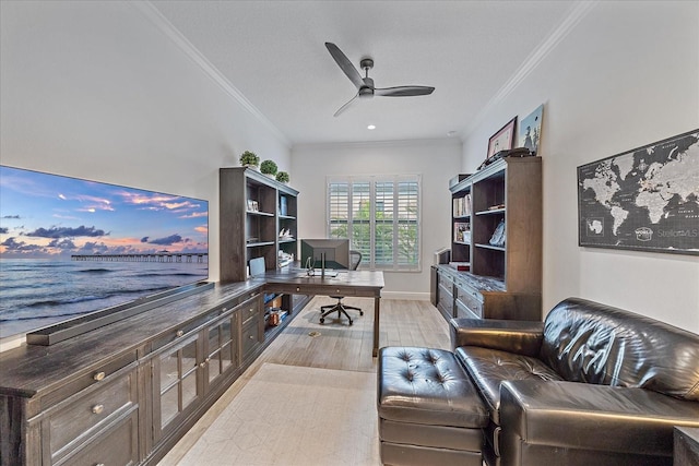 office space with ornamental molding, a ceiling fan, and baseboards