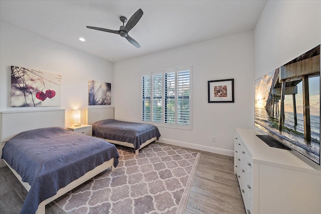 bedroom featuring a ceiling fan, recessed lighting, baseboards, and light wood finished floors