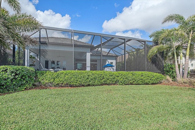 exterior space with a ceiling fan and a lanai