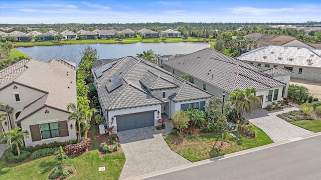 birds eye view of property featuring a residential view and a water view