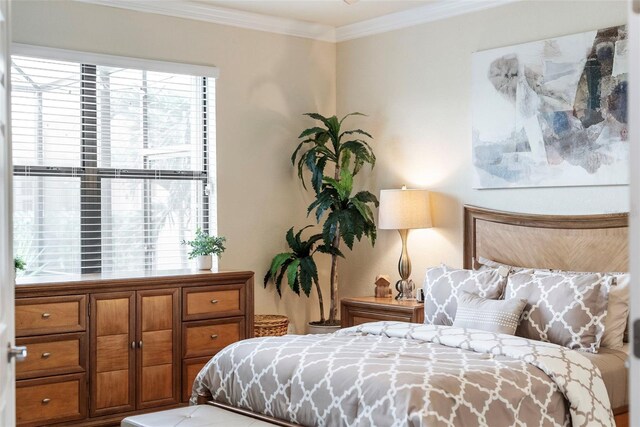 bedroom with ornamental molding