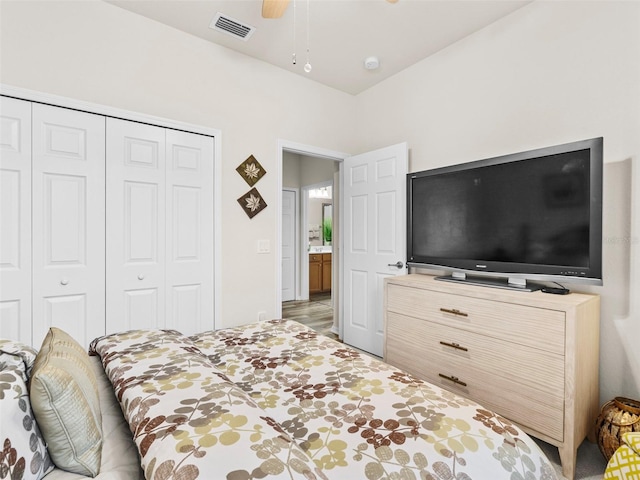 bedroom with ceiling fan and a closet