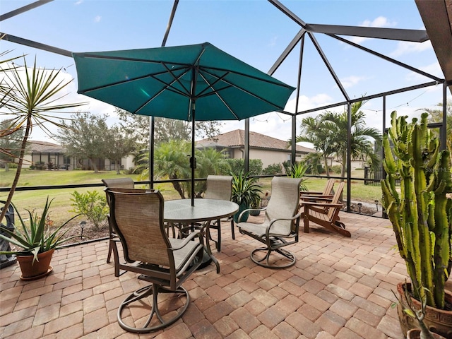 view of patio with glass enclosure