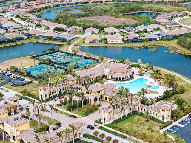 birds eye view of property with a water view