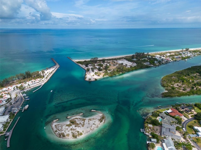 drone / aerial view featuring a water view and a view of the beach