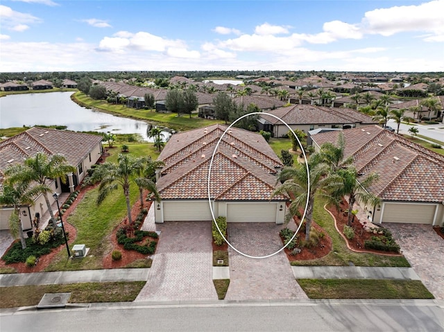 aerial view featuring a residential view and a water view