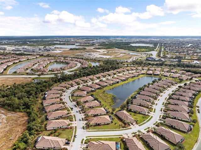 birds eye view of property featuring a water view and a residential view