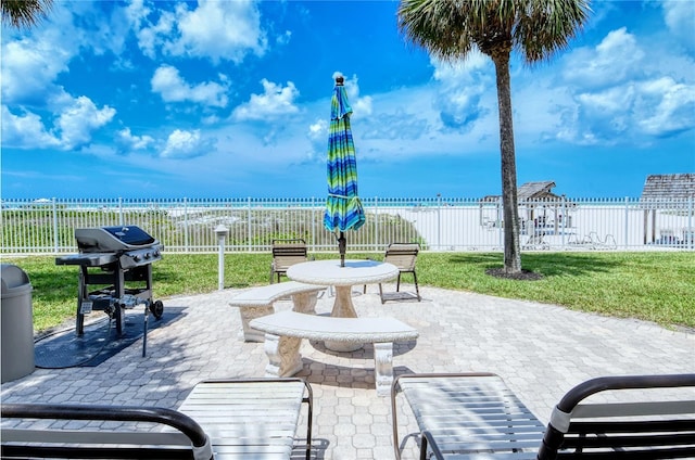 surrounding community featuring a lawn and a patio