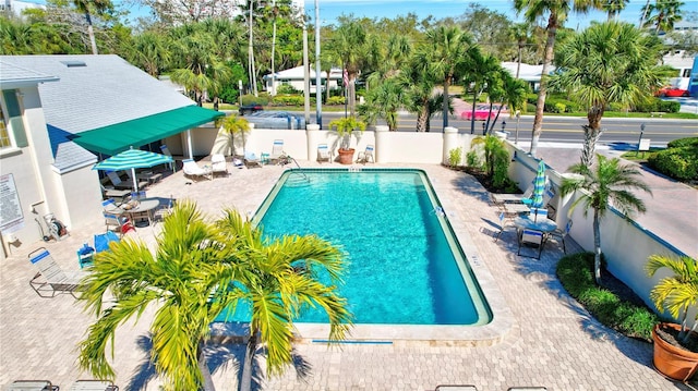 view of swimming pool with a patio