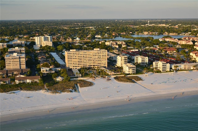 bird's eye view featuring a water view and a view of the beach