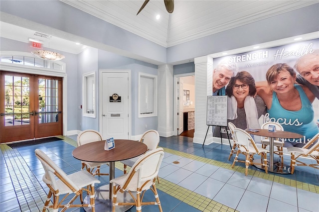 dining room featuring tile patterned floors, high vaulted ceiling, and french doors