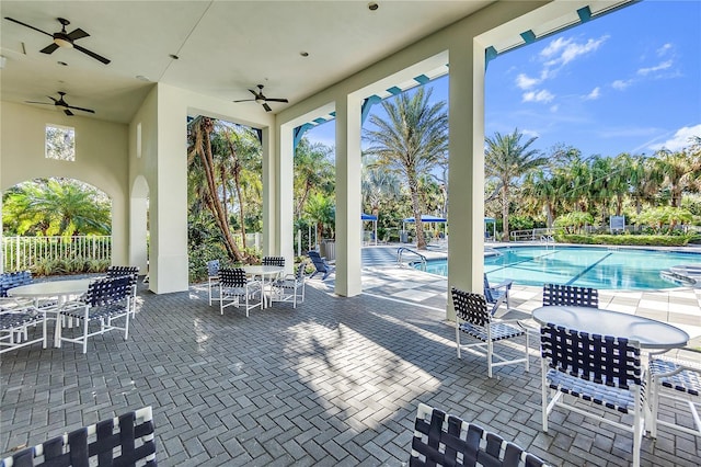 view of patio / terrace featuring ceiling fan and a community pool