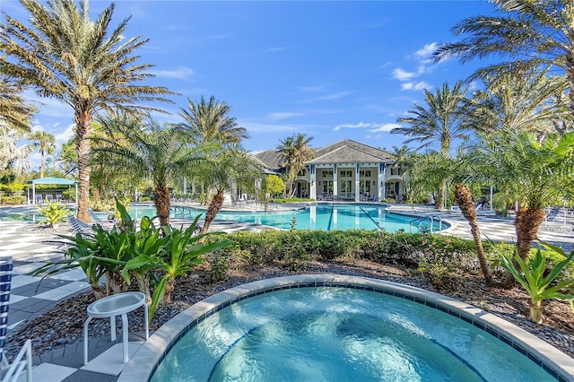 view of pool featuring a hot tub