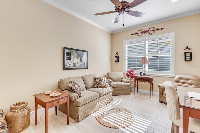 living room with light hardwood / wood-style flooring, ceiling fan, and ornamental molding