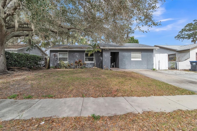 ranch-style house with a front lawn