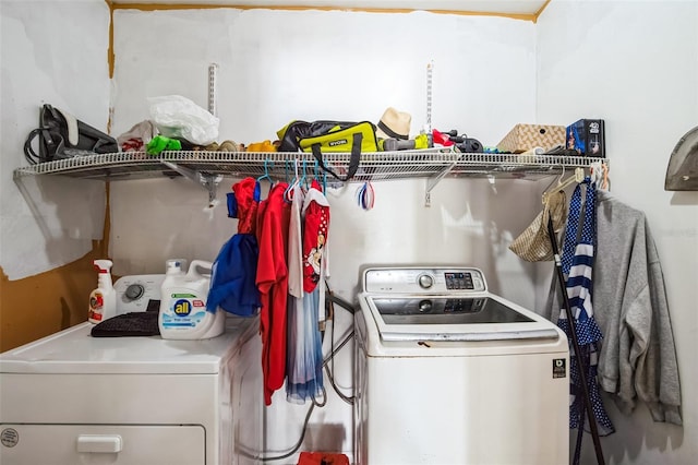 washroom featuring independent washer and dryer