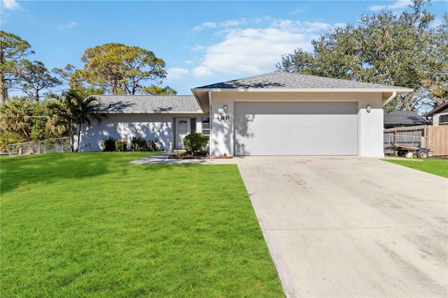 single story home featuring a front lawn and a garage