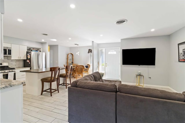 living room with light hardwood / wood-style floors